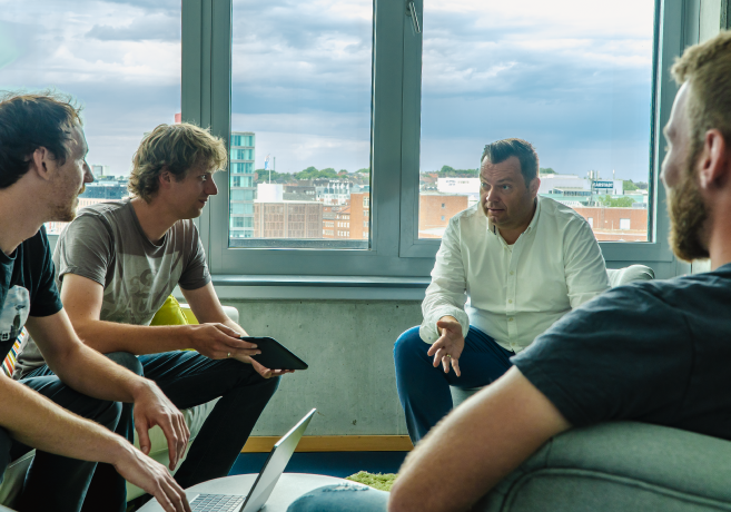 IT department employees in a meeting.